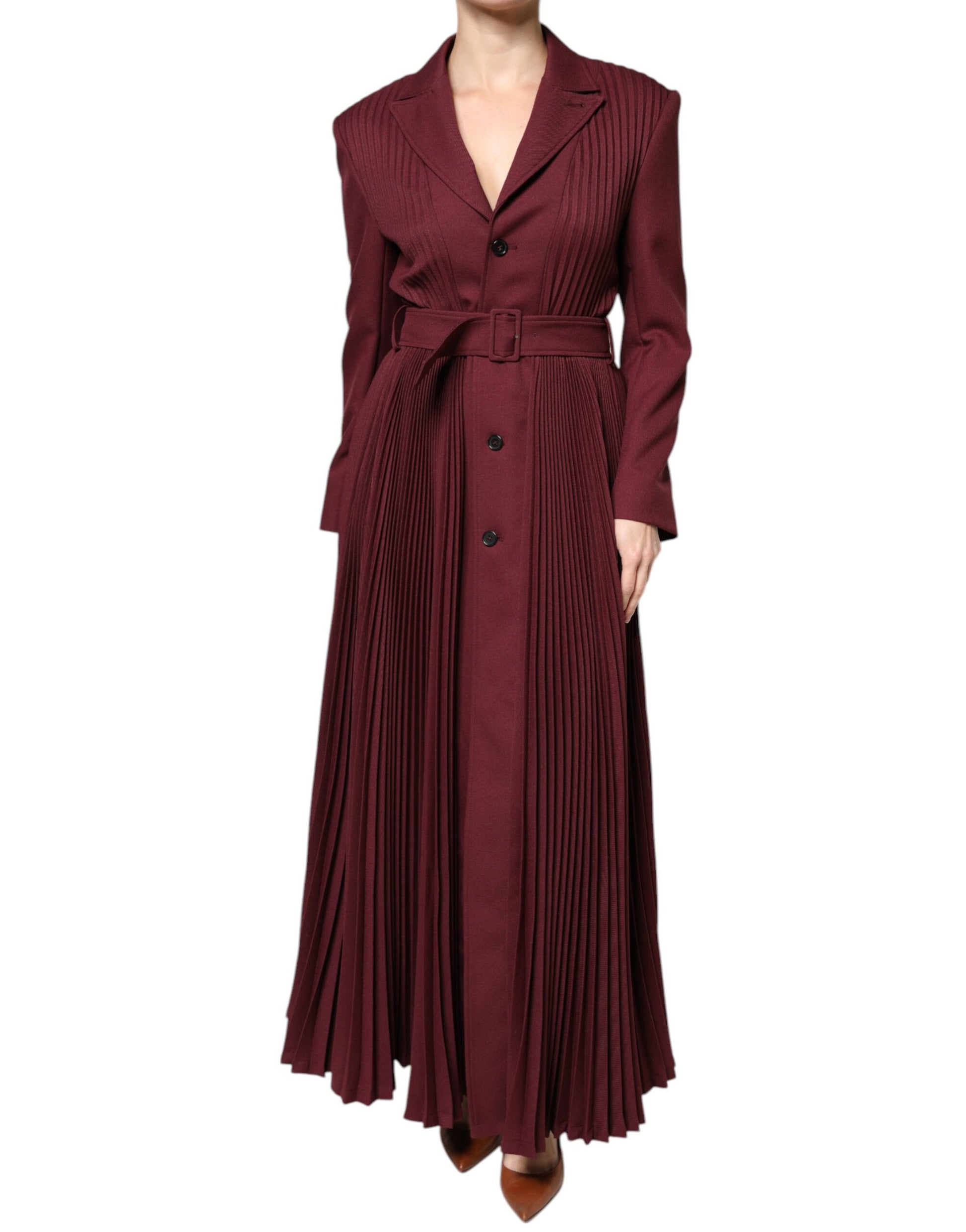 A maroon dress with belted waist, long sleeves and button down front. It has ruffled hem detailing