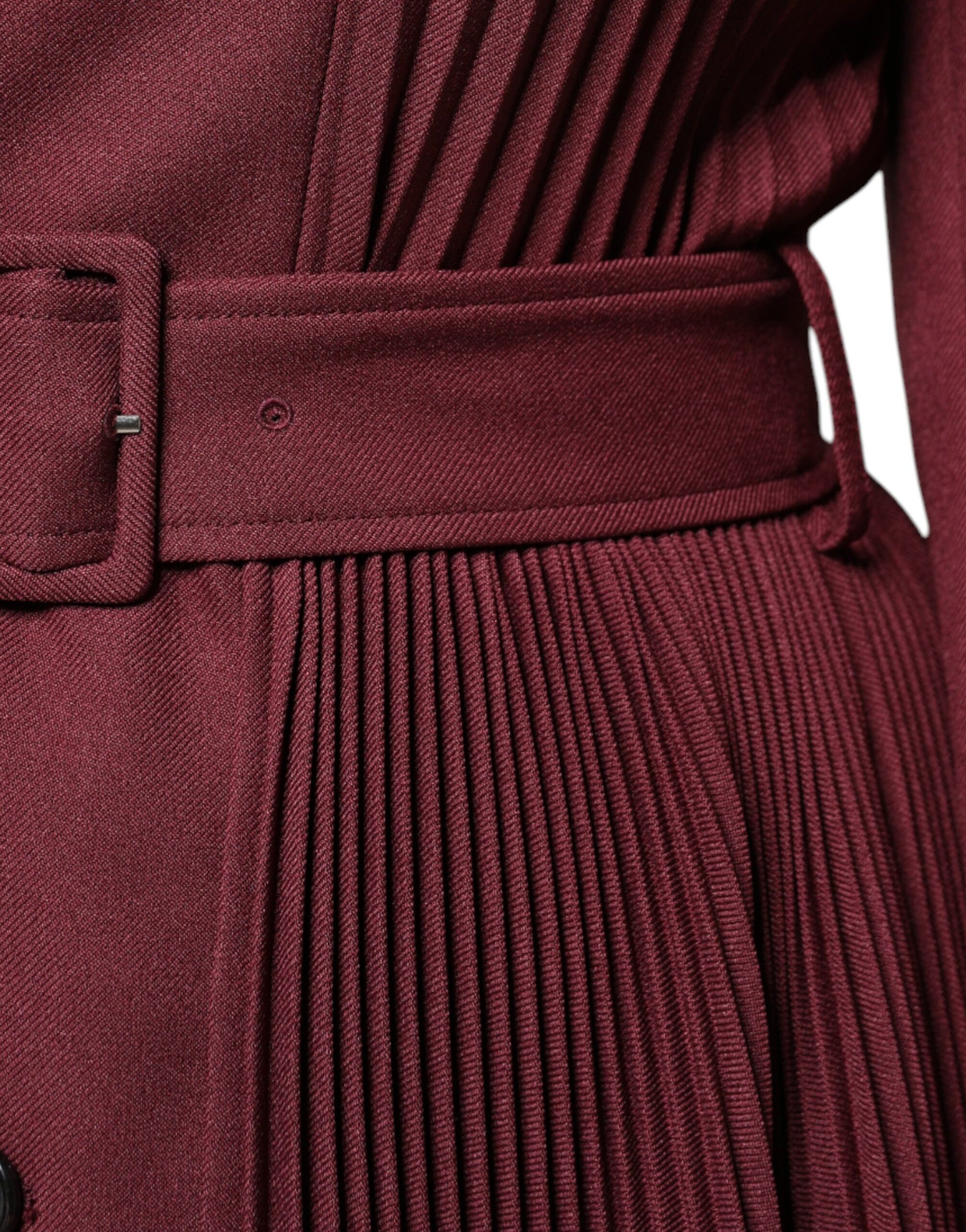 A maroon belted button down dress with a textured skirt