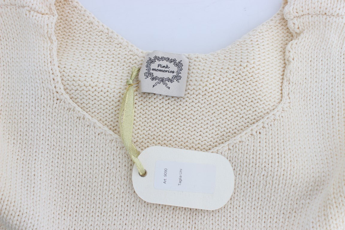 Tan knit sweater with tag on neck