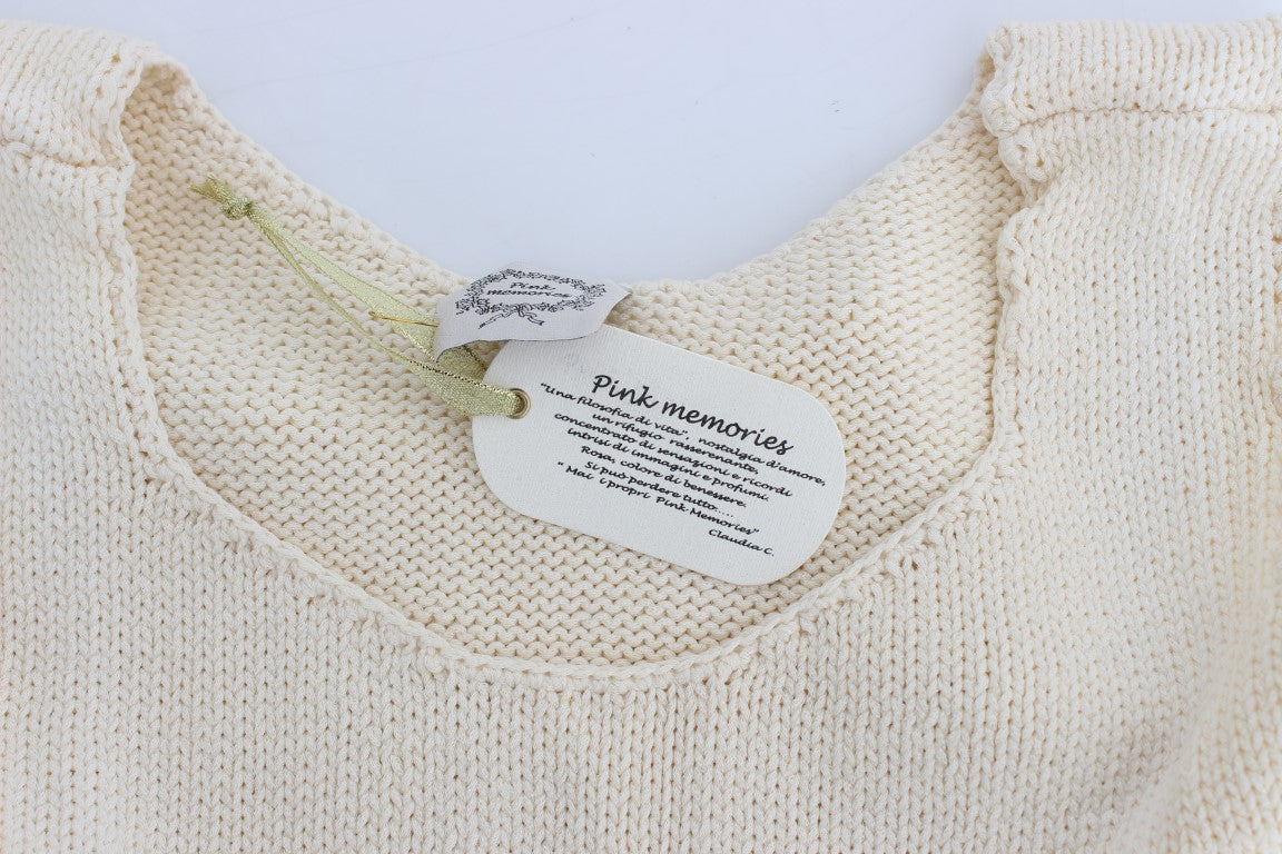Tan knit sweater with tag on neck