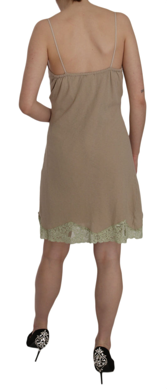 A beige lace spaghetti strap mini cotton dress