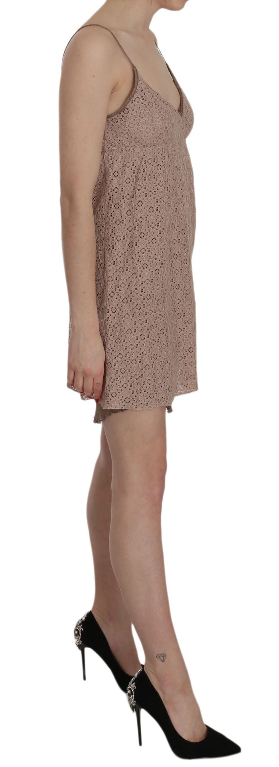 A beige spaghetti strap dress with a mini length