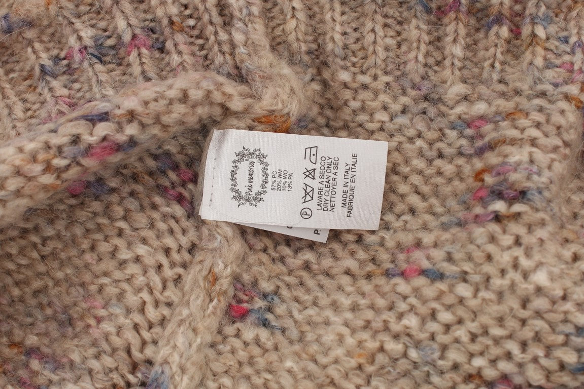 Handmade knitted sweater with tag attached to neckline