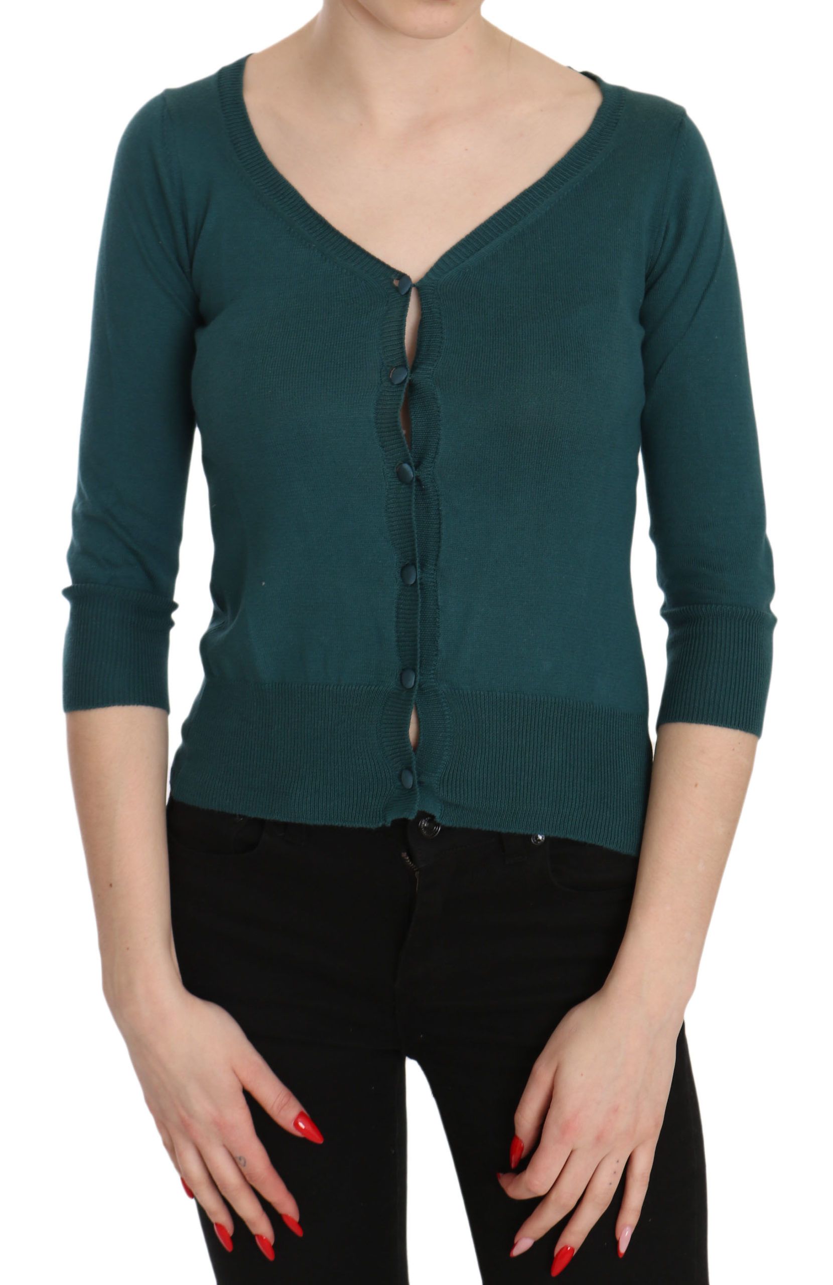 Woman wearing a dark green sweater with a V neckline