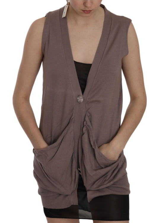 Woman wearing a sleeveless vest over black dress
