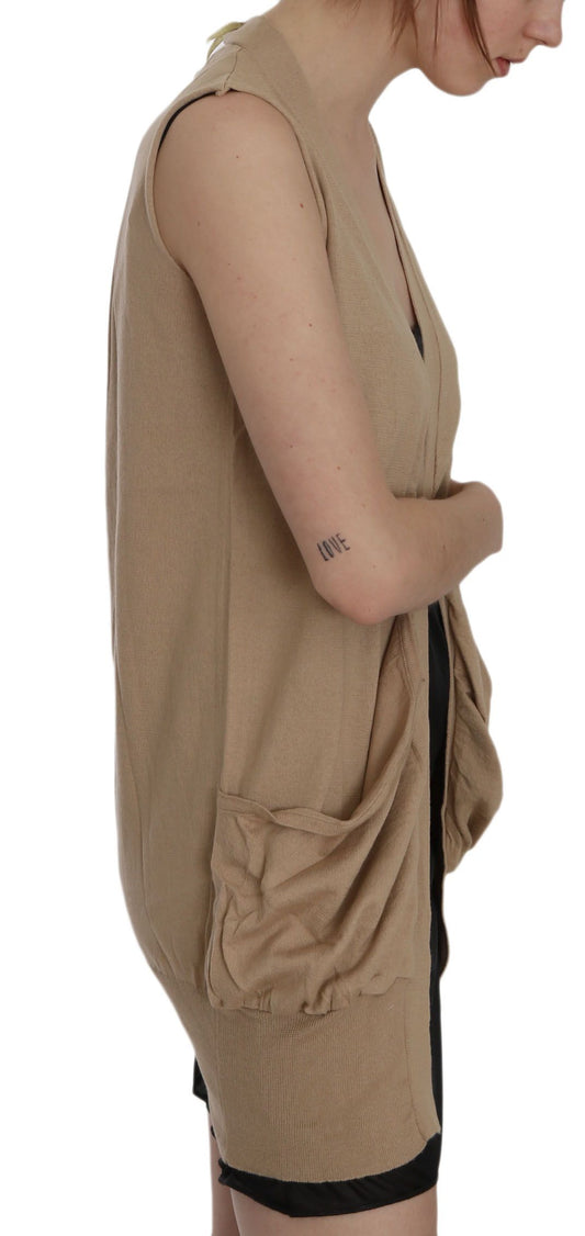 Woman wearing a beige dress with black straps