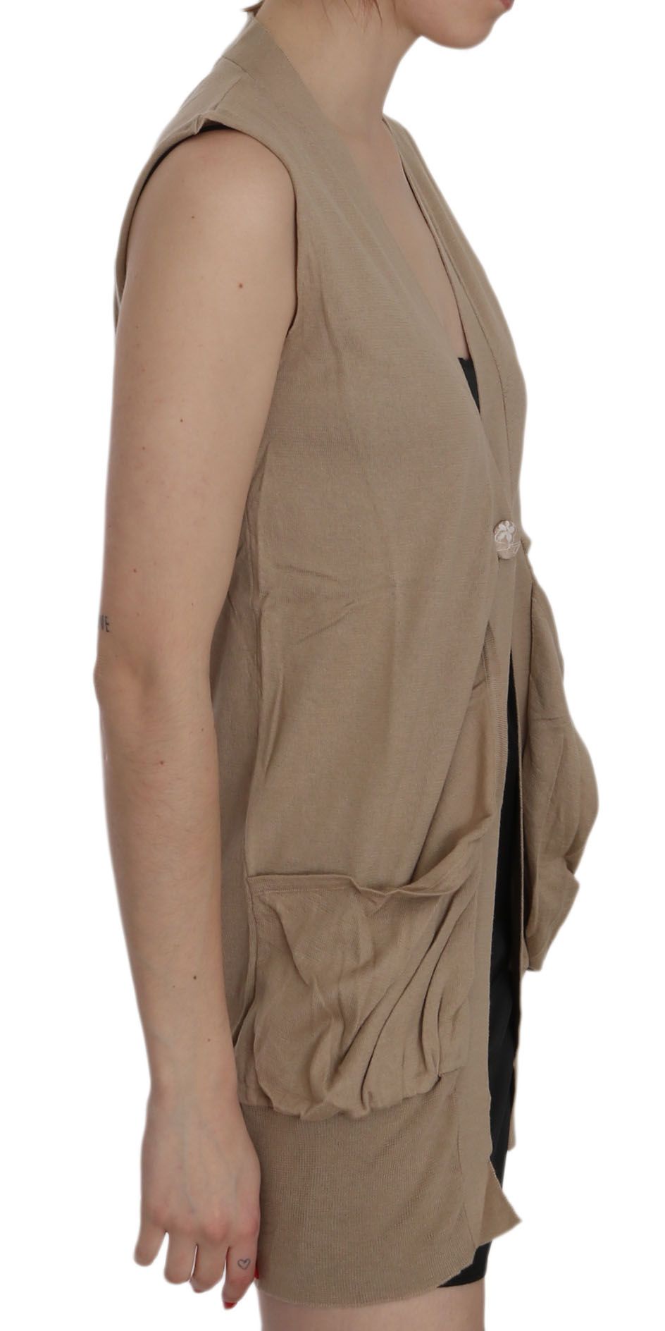 Tan vest over black top