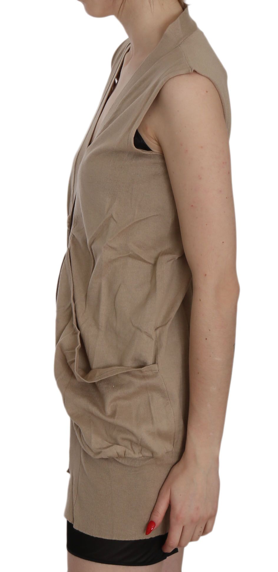 Tan short sleeve vest over a black top