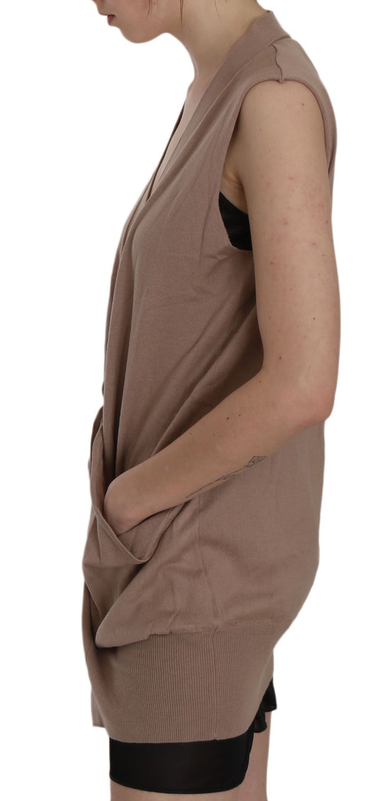 Woman wearing a beige tank top with black straps