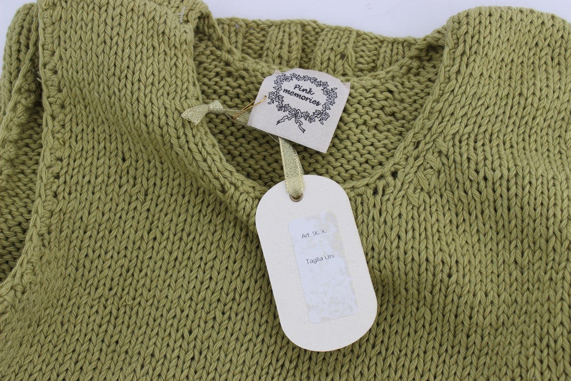 Green knitted sweater with tag attached to neckline