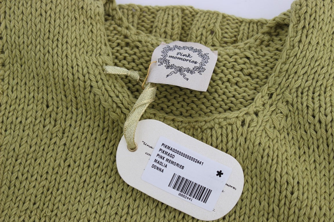 Green knitted sweater with tag attached to neckline