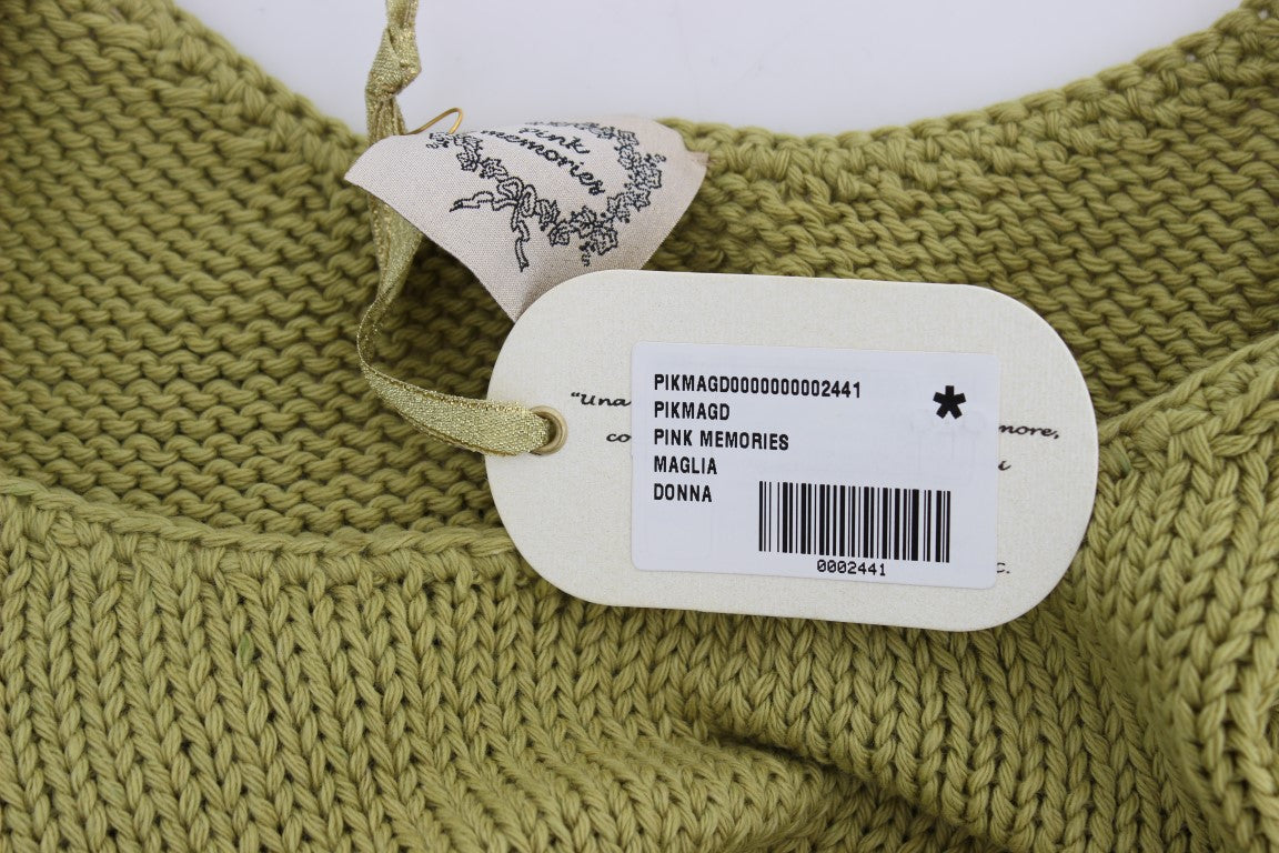 Green knitted sweater with tag attached to neckline