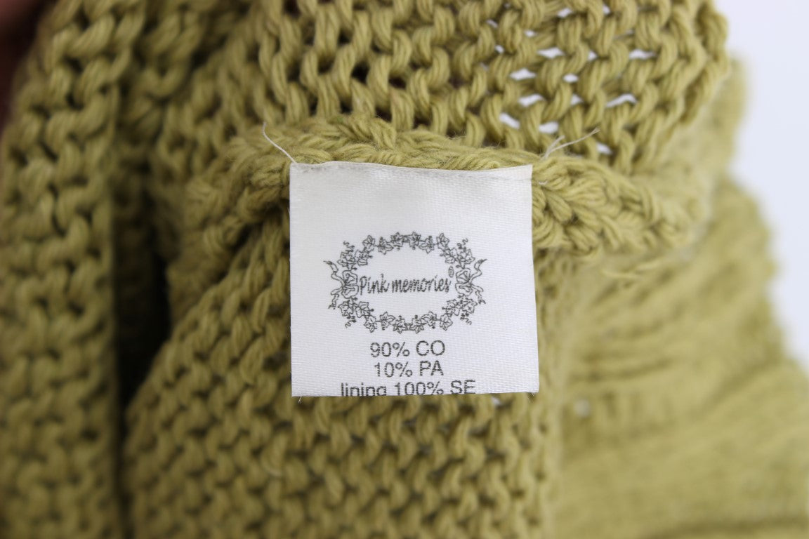 Green knitted item with label indicating 90% cotton