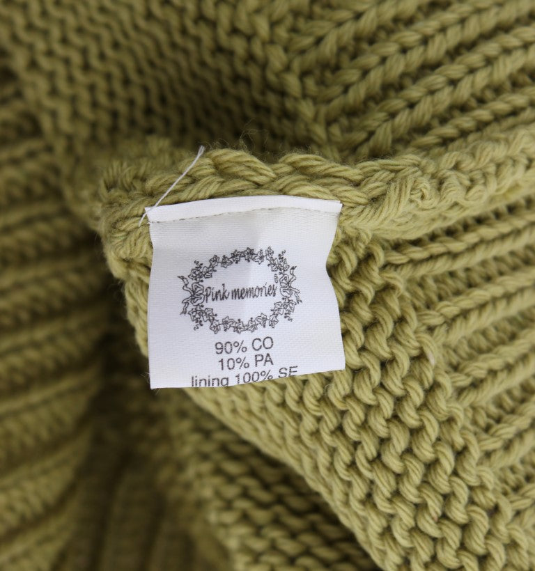 Green knit sweater with tag on neckline