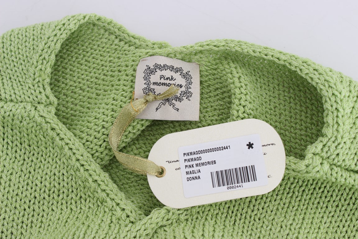 Green knitted sweater with tag attached to neckline