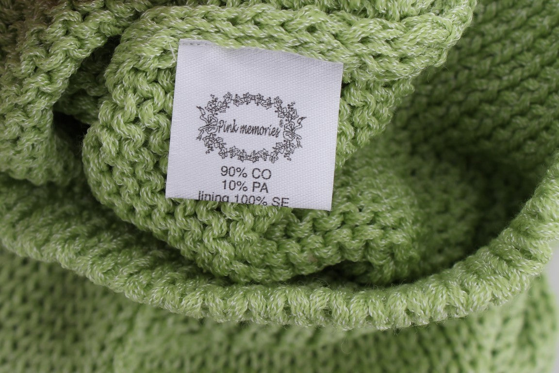 Green knitted blanket with label