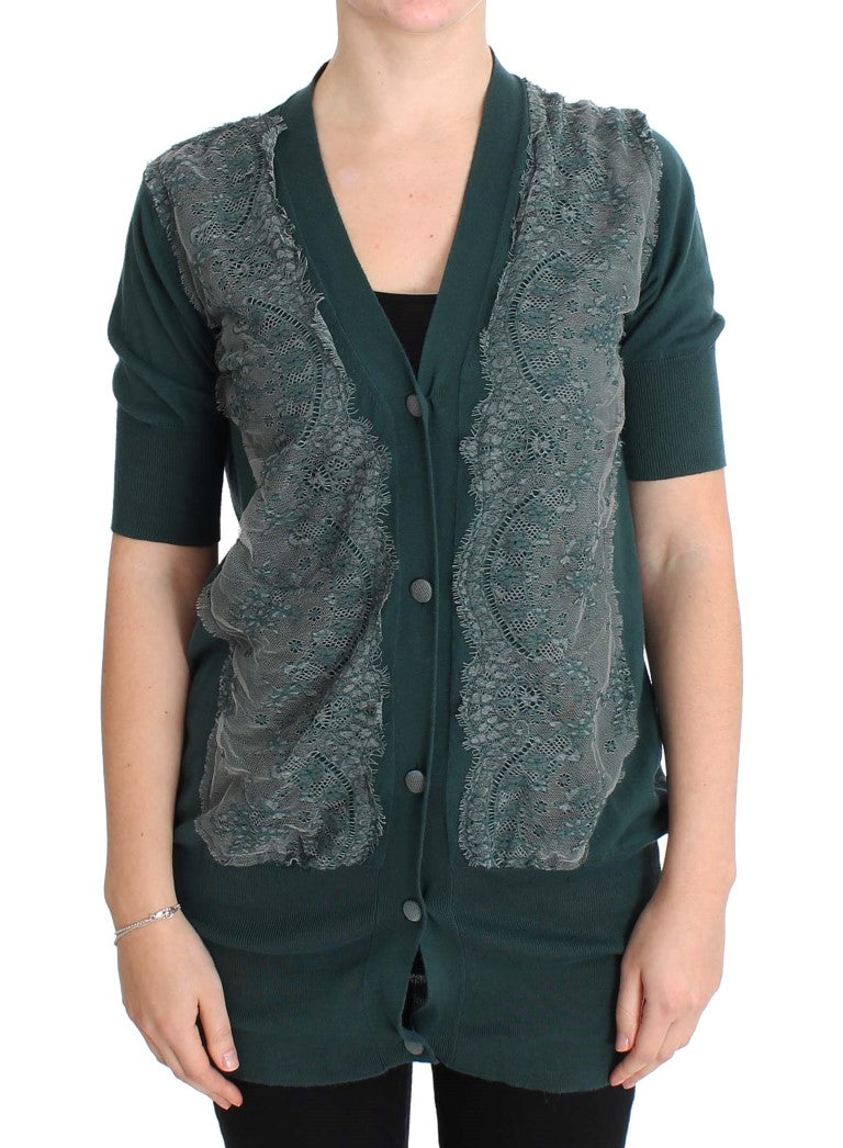Green lace vest over black shirt