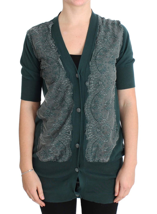 Green lace vest over black shirt