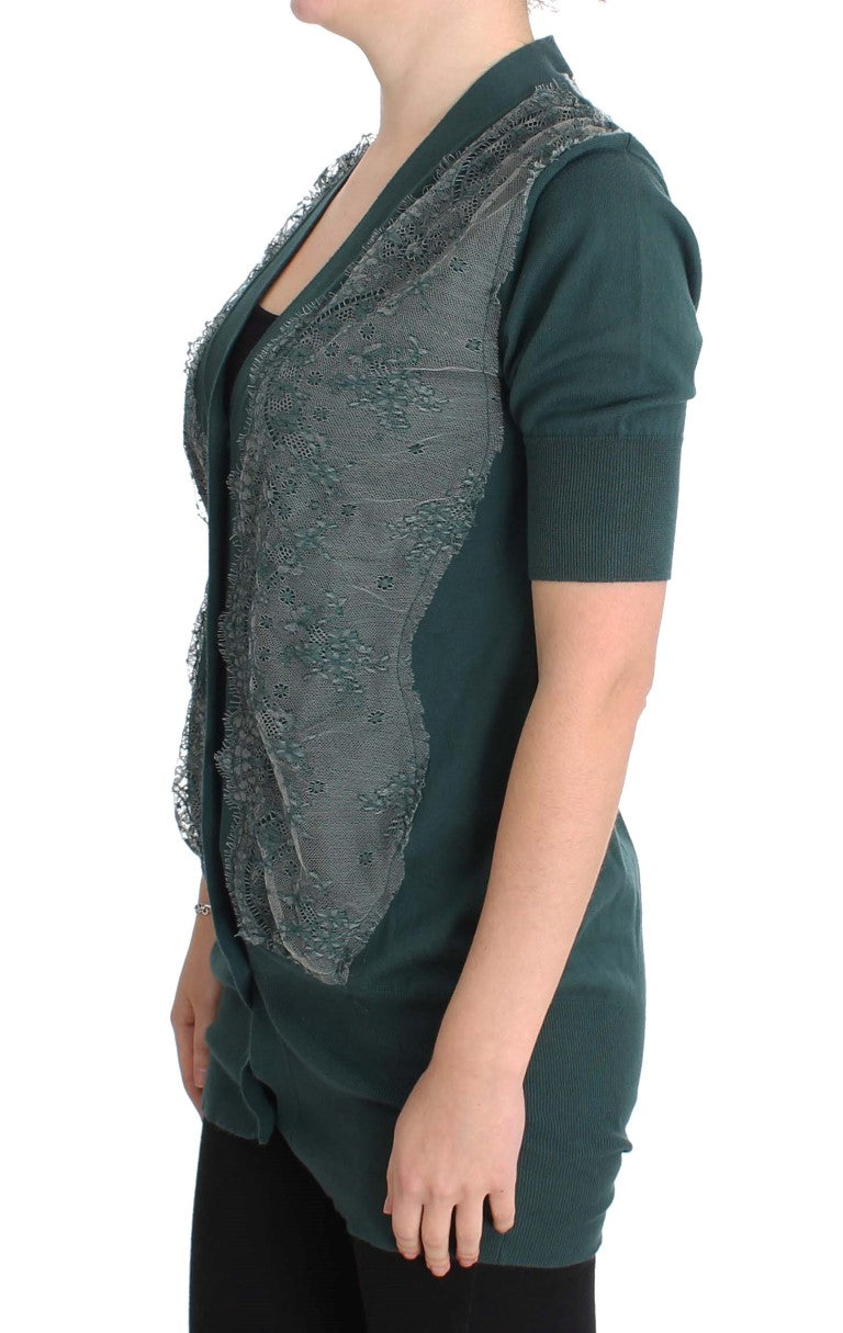Green vest over black top