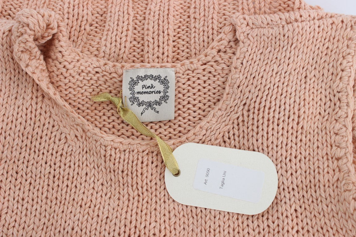 Pink knitted sweater with tag on neck