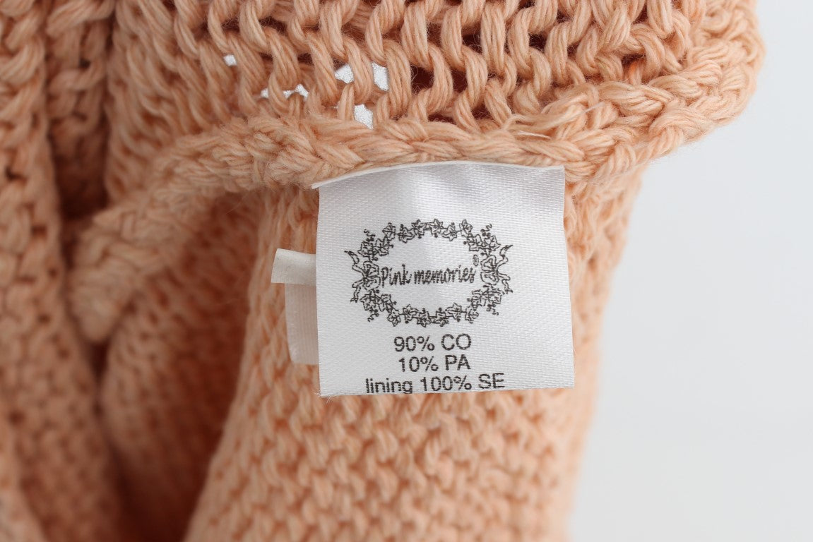 Knitted sweater with tag indicating 90% PA