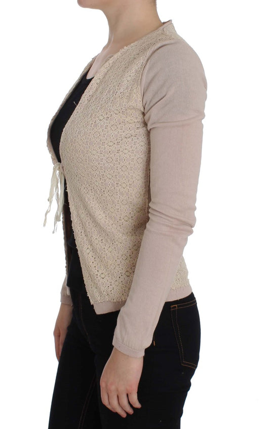 Woman wearing a beige vest over black top