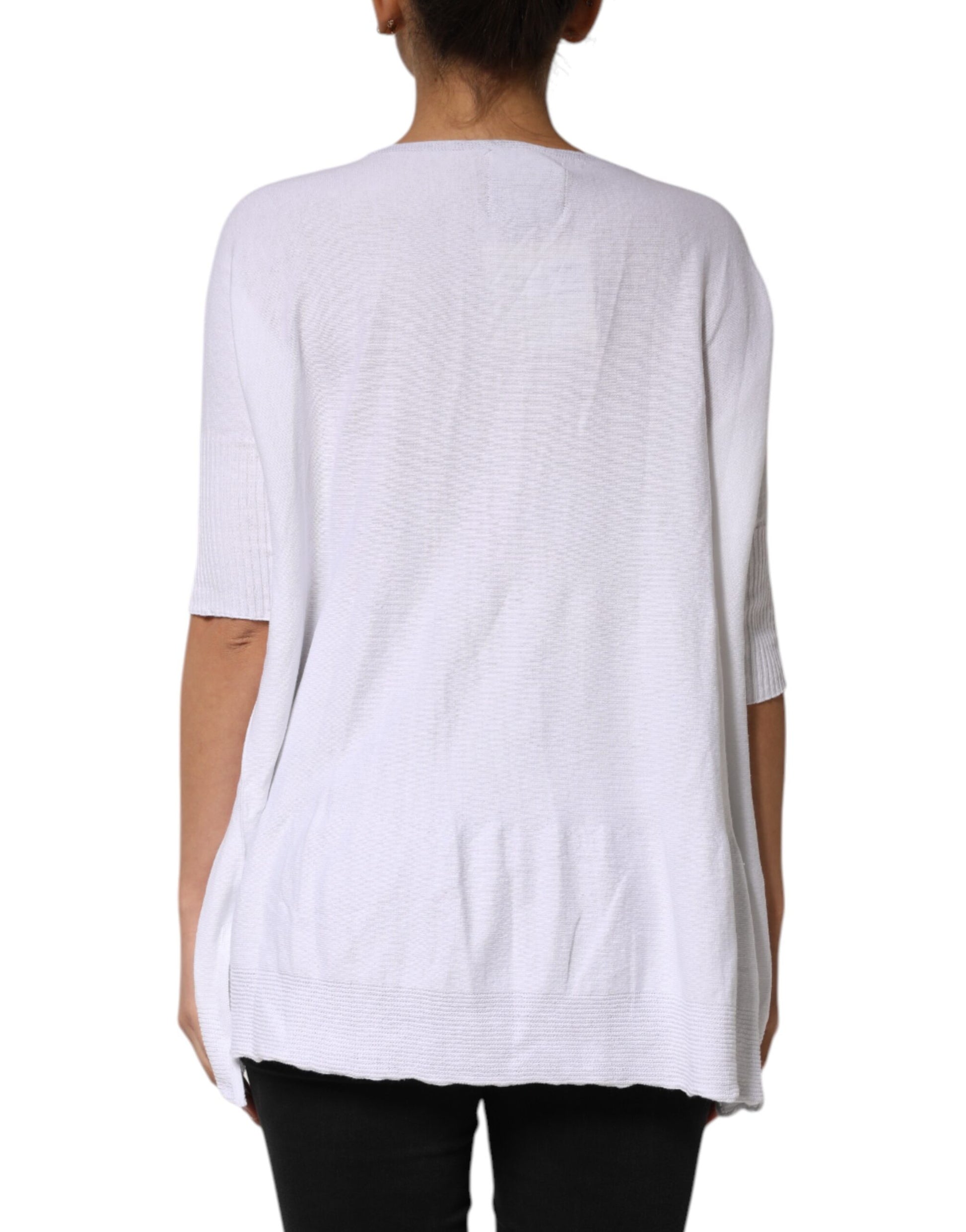 Long sleeve white sweater on a person's back