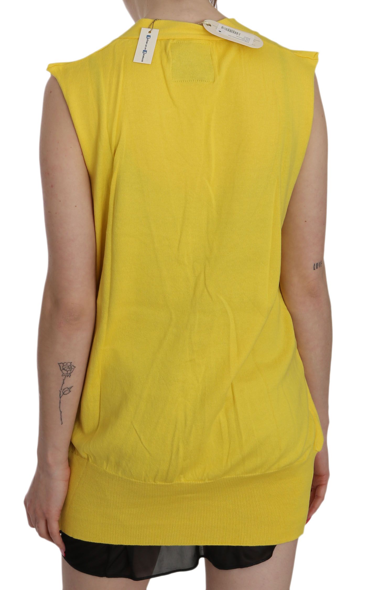 Yellow sleeveless top on a person