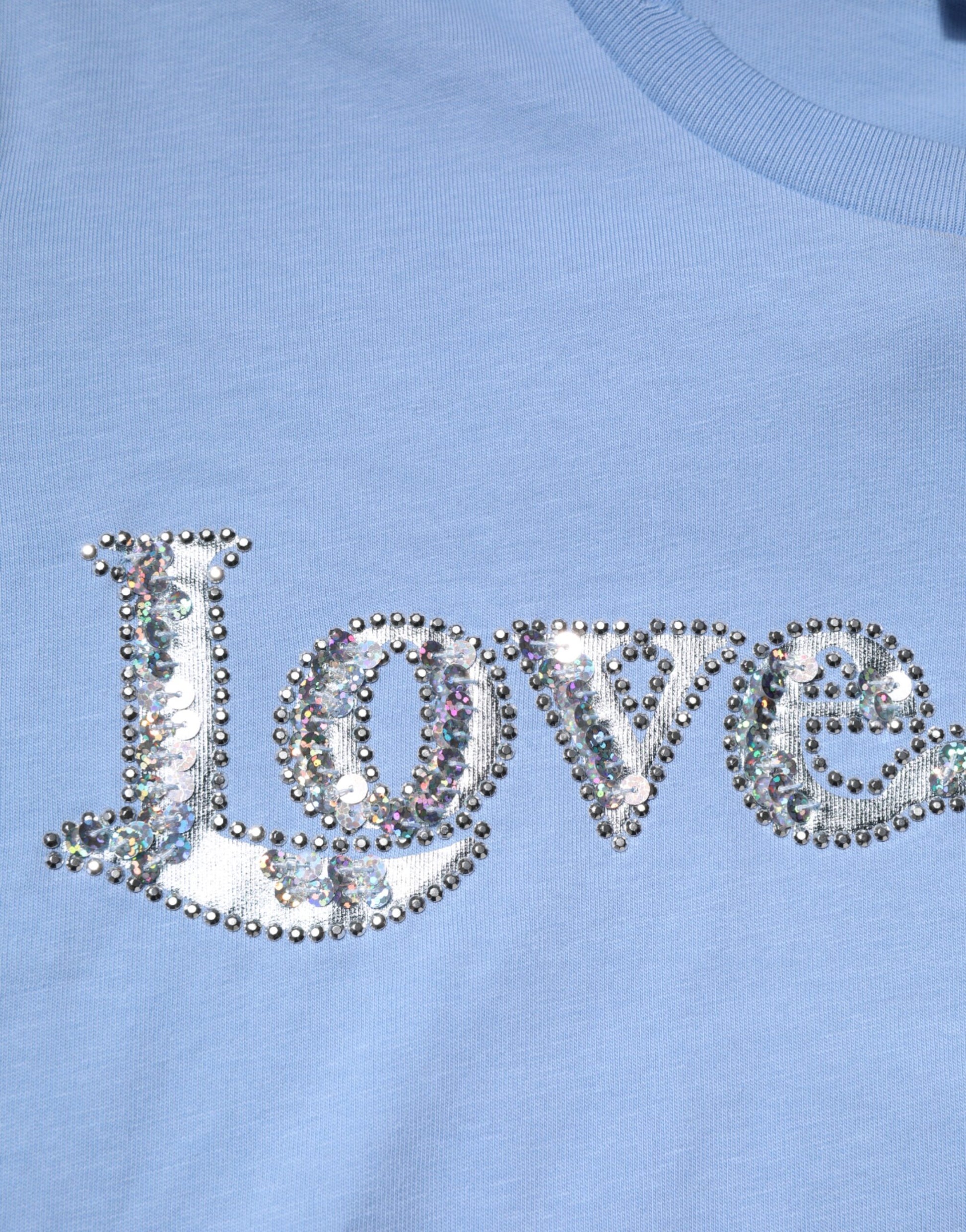 Blue shirt with sparkly love letters