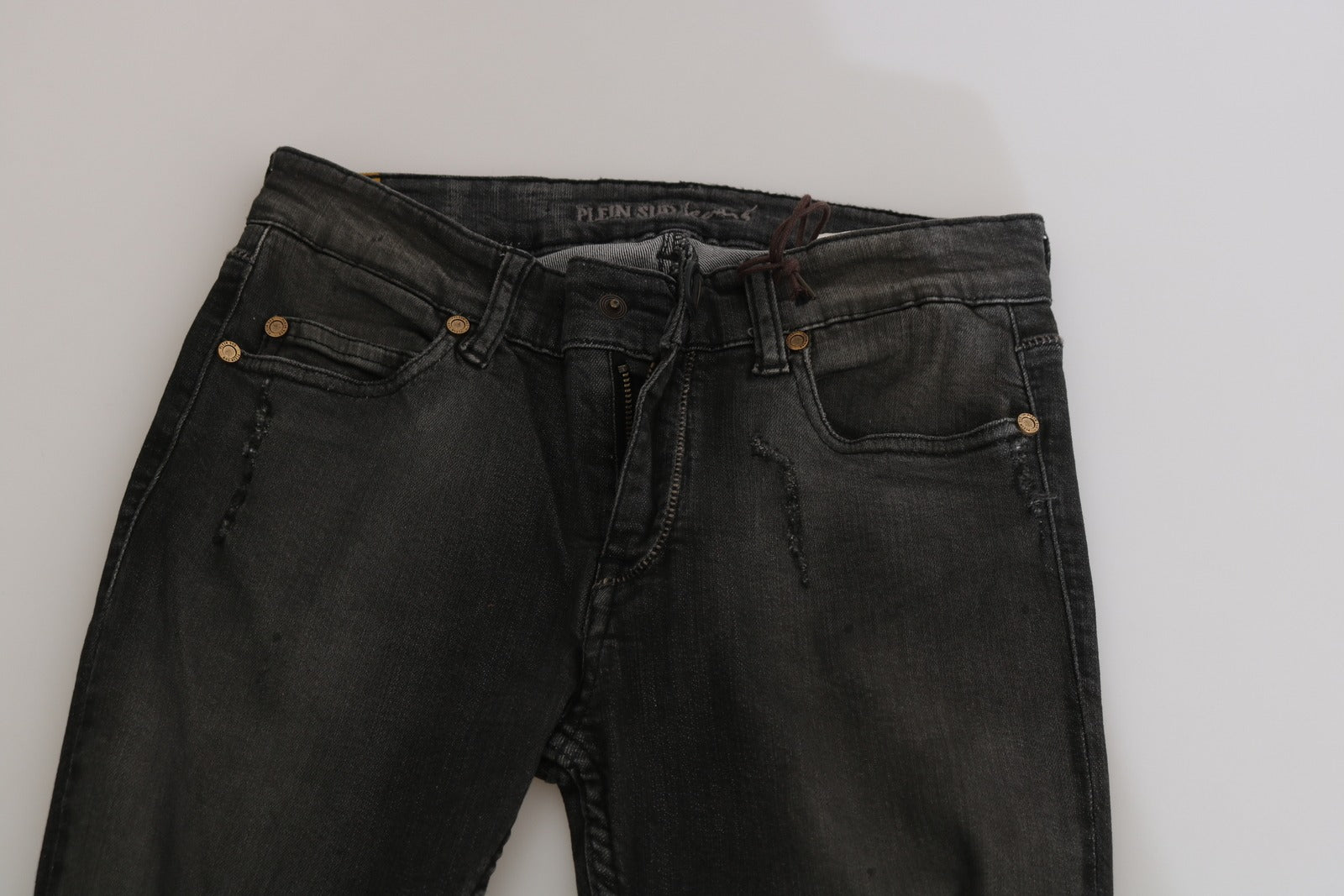 Pair of blue jeans on a white surface
