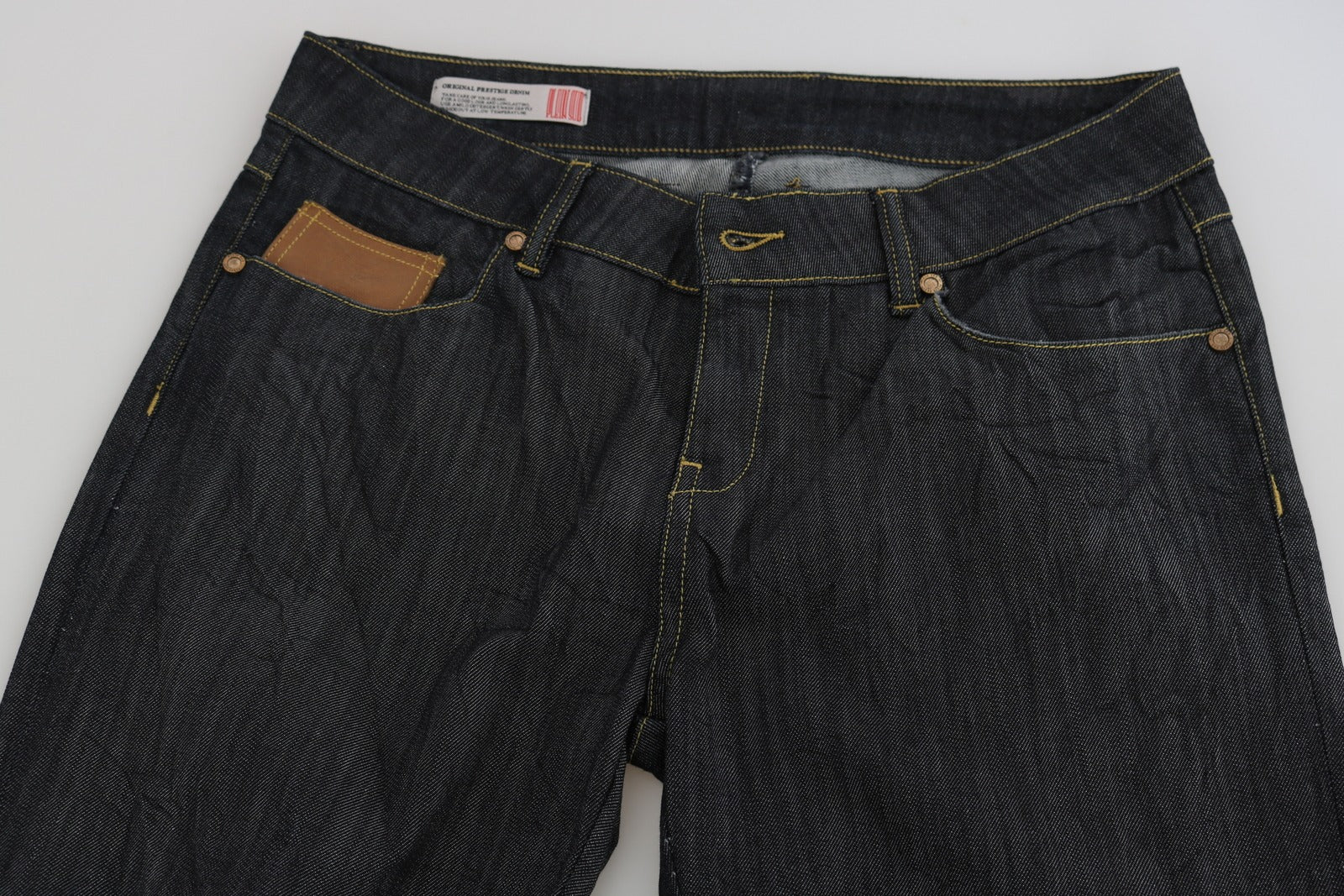 Pair of blue jeans on a white surface