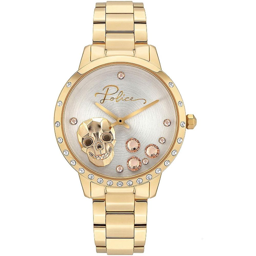 A gold watch with a skull design on the face