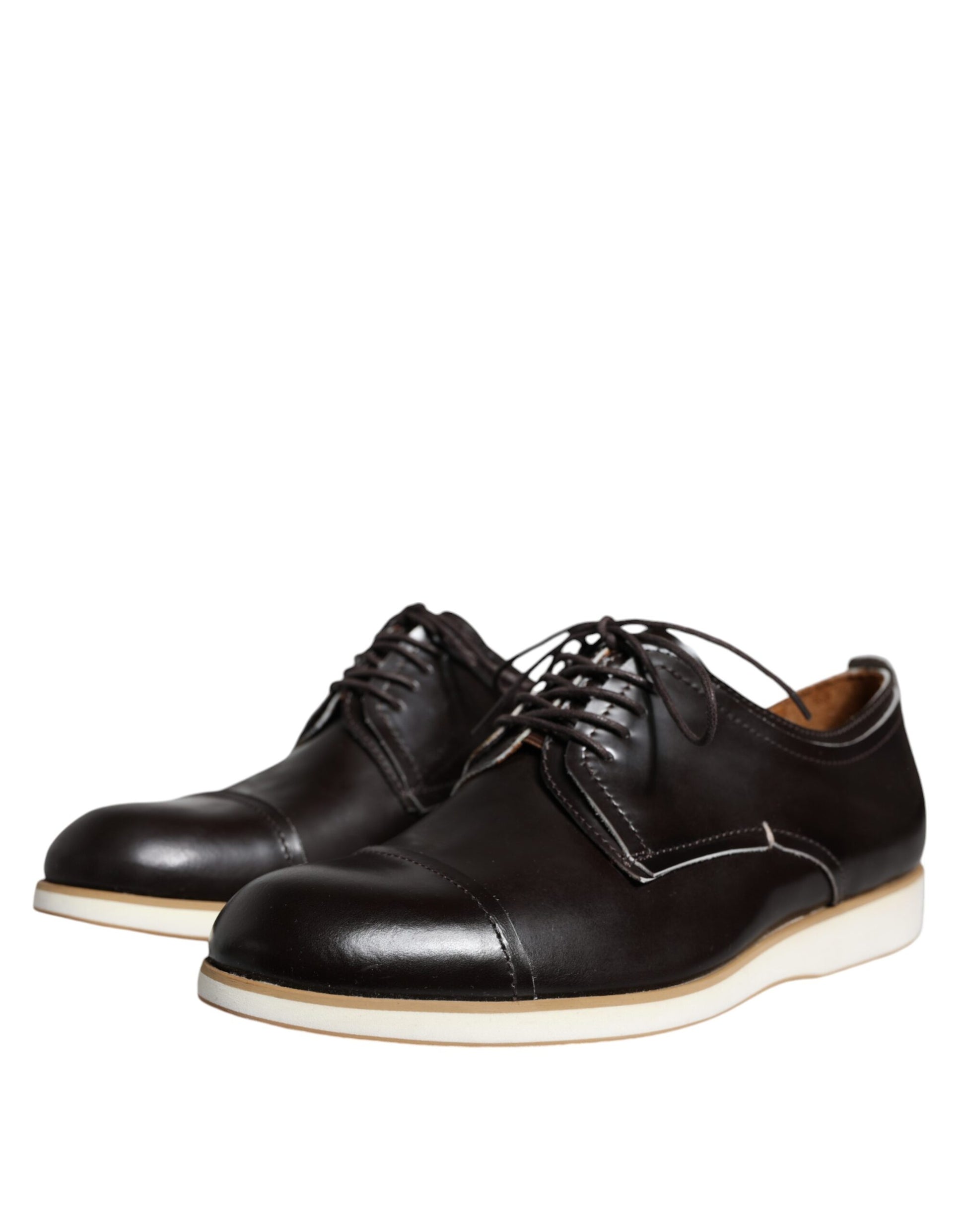 Pair of black leather lace-up dress shoes with white soles, designed for men's formal wear