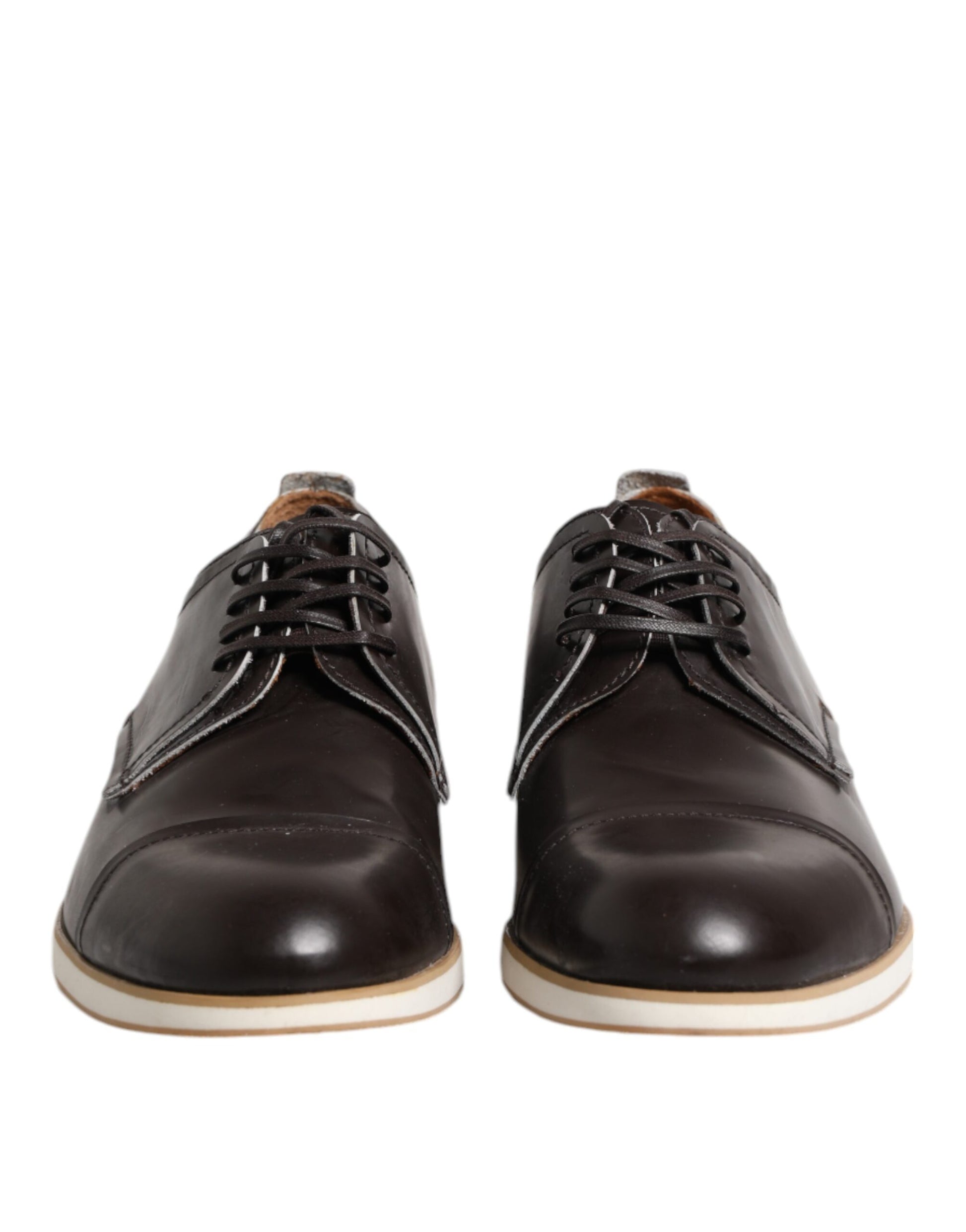 Pair of dark brown leather lace-up dress shoes with white soles and black laces