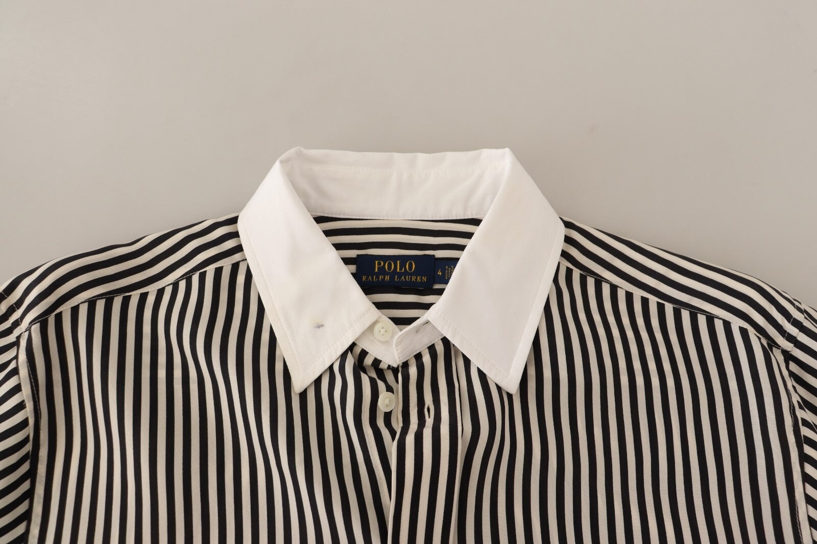 Black and white striped shirt on hanger