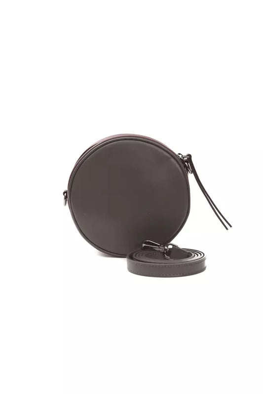 Black circular object with handle