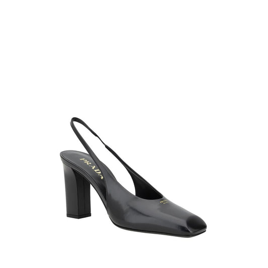 Black high heel shoe with strap over foot