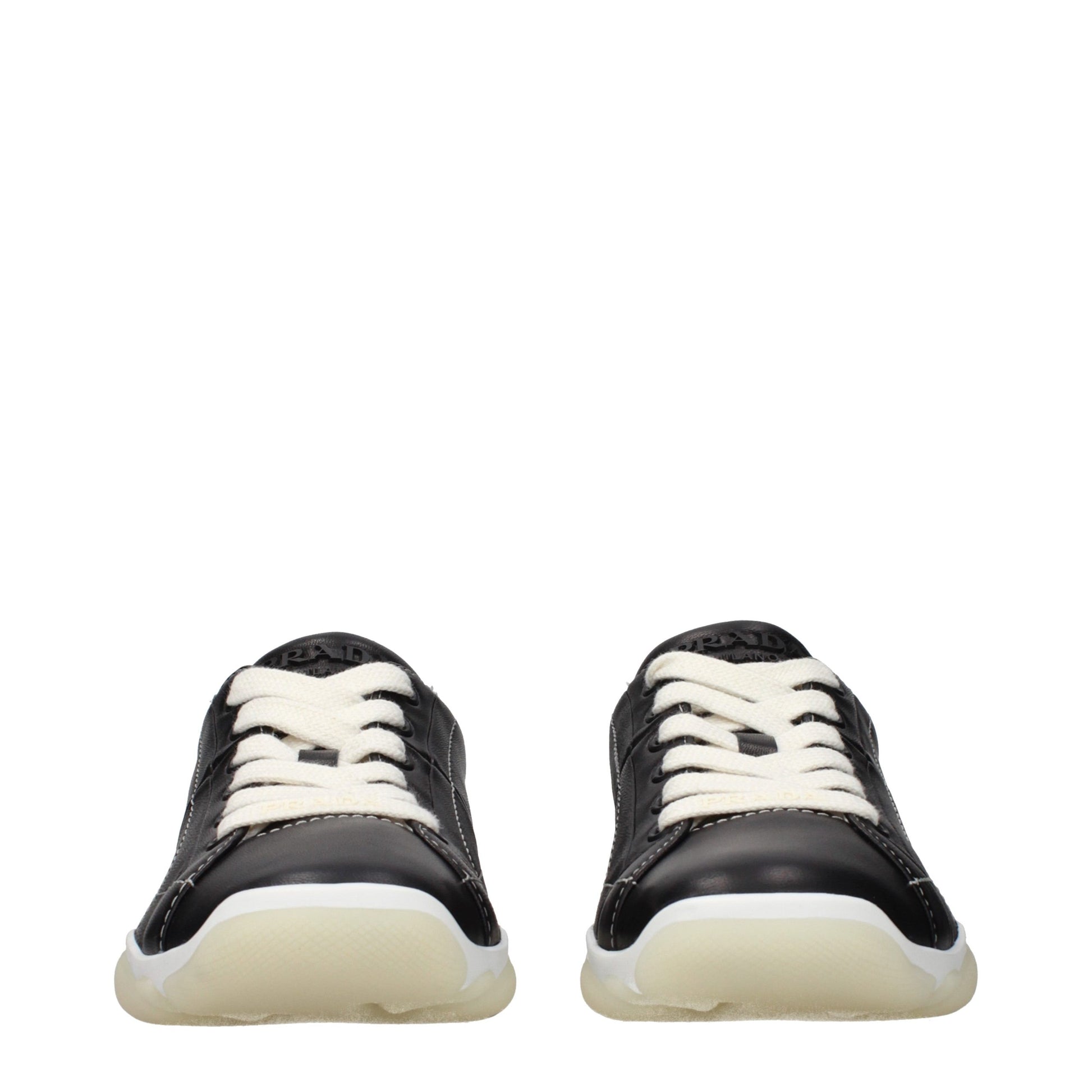 Pair of black leather sneakers with white laces and soles
