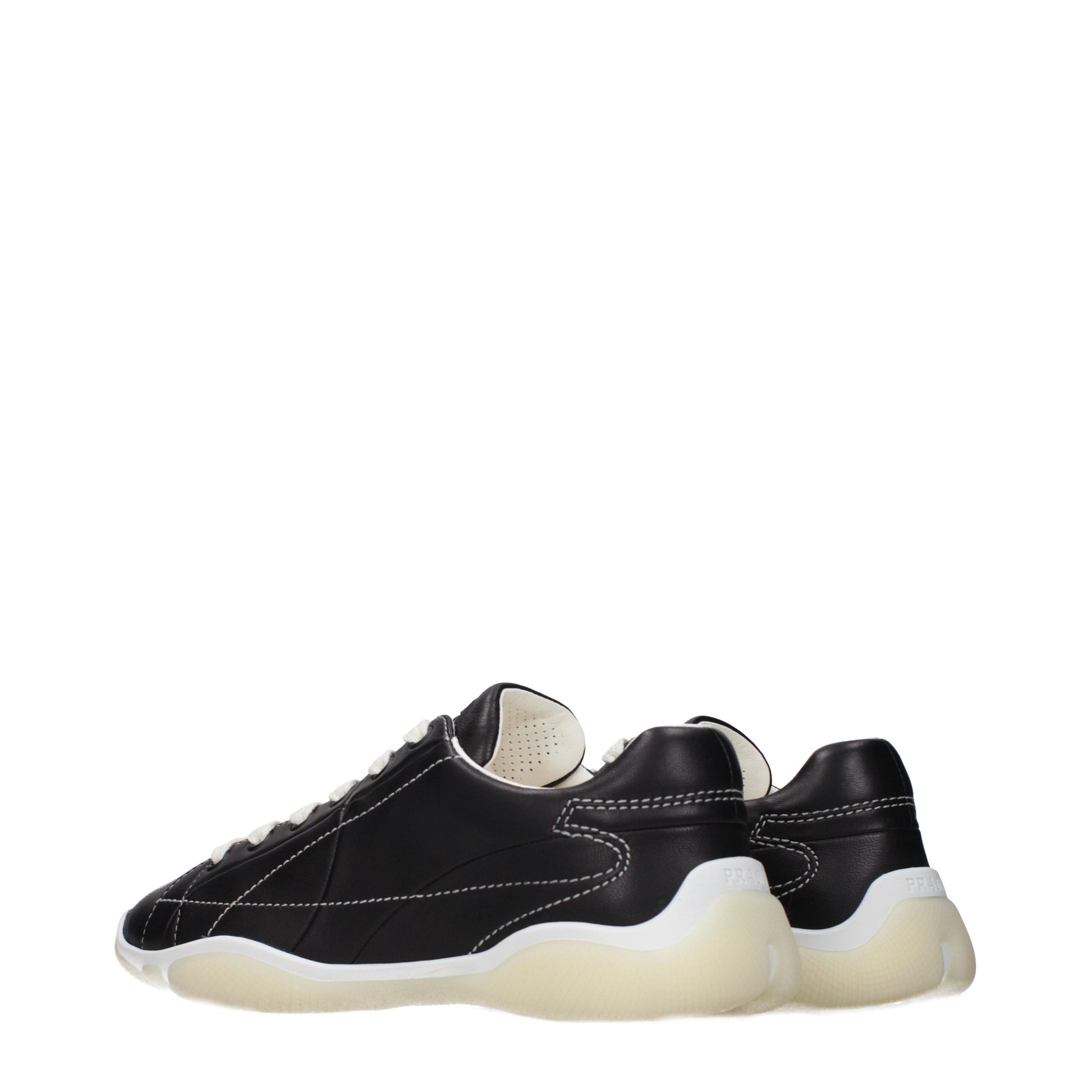 Pair of black leather sneakers with white soles