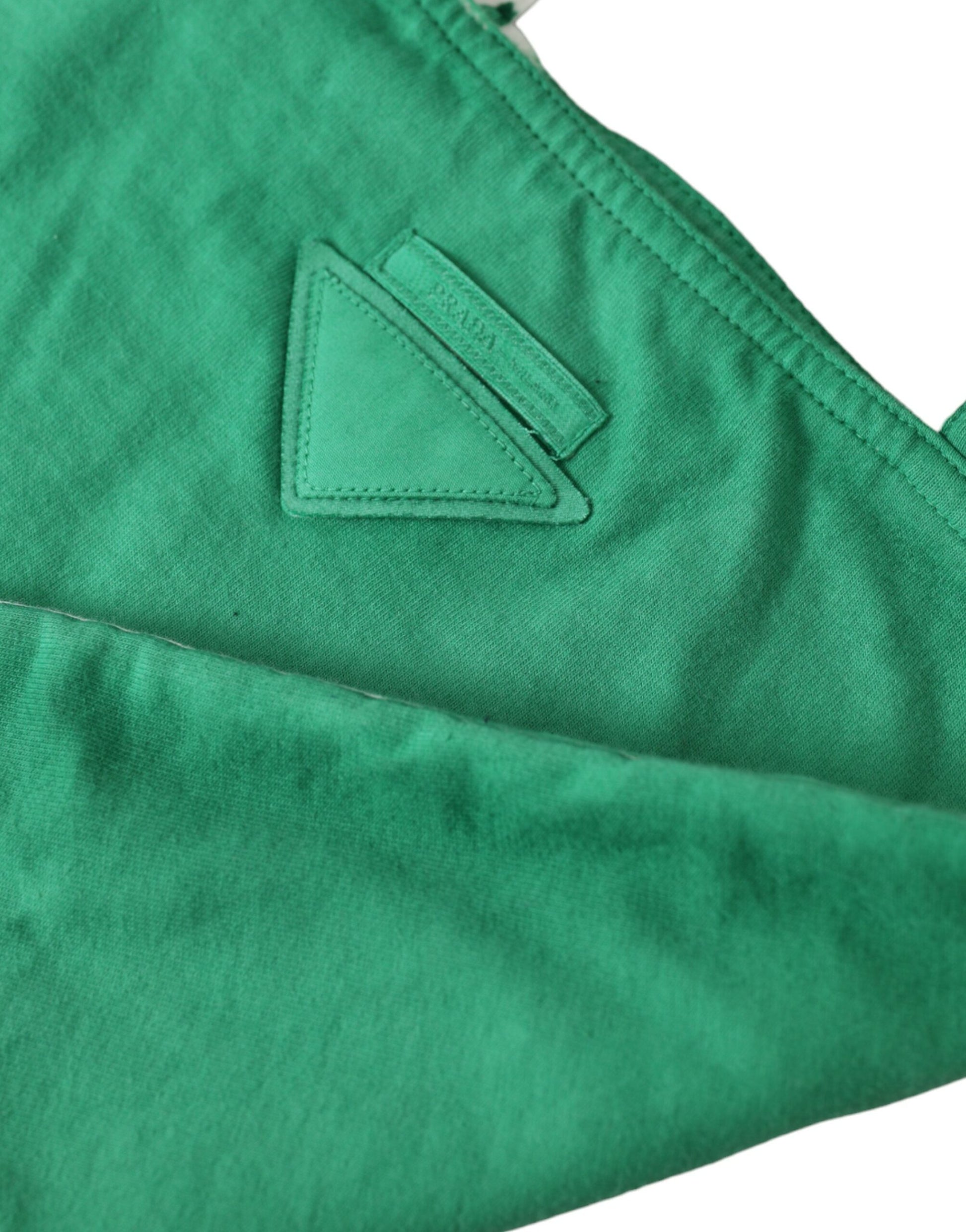 Green fabric with a white triangle logo on it
