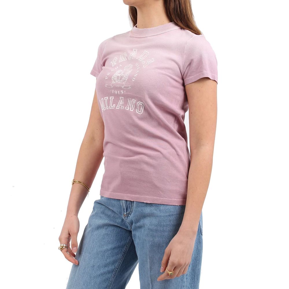 Woman wearing pink t-shirt with white lettering
