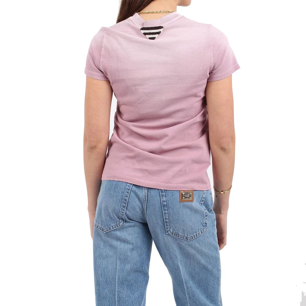 Woman wearing pink shirt and blue jeans
