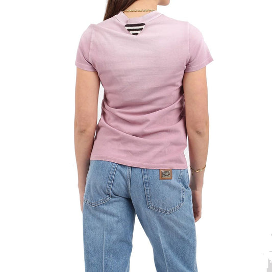 Woman wearing pink shirt and blue jeans