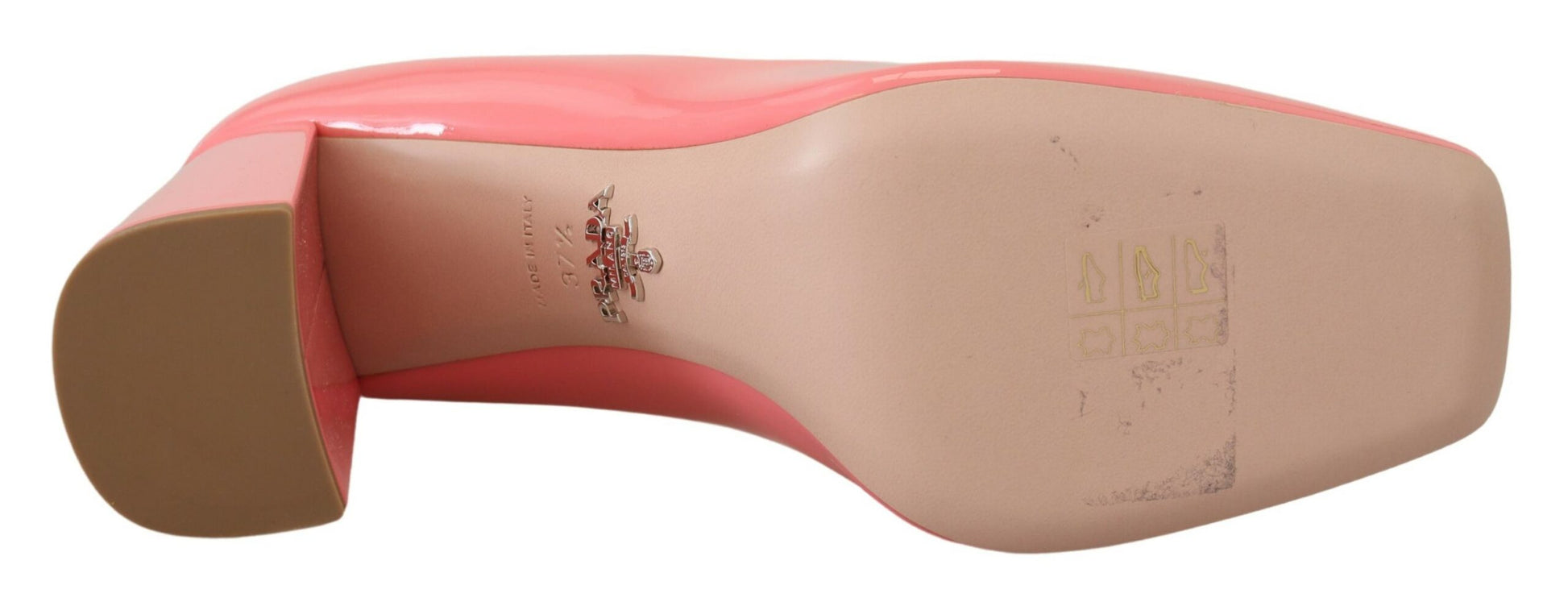 Pair of red shoes with white soles and laces