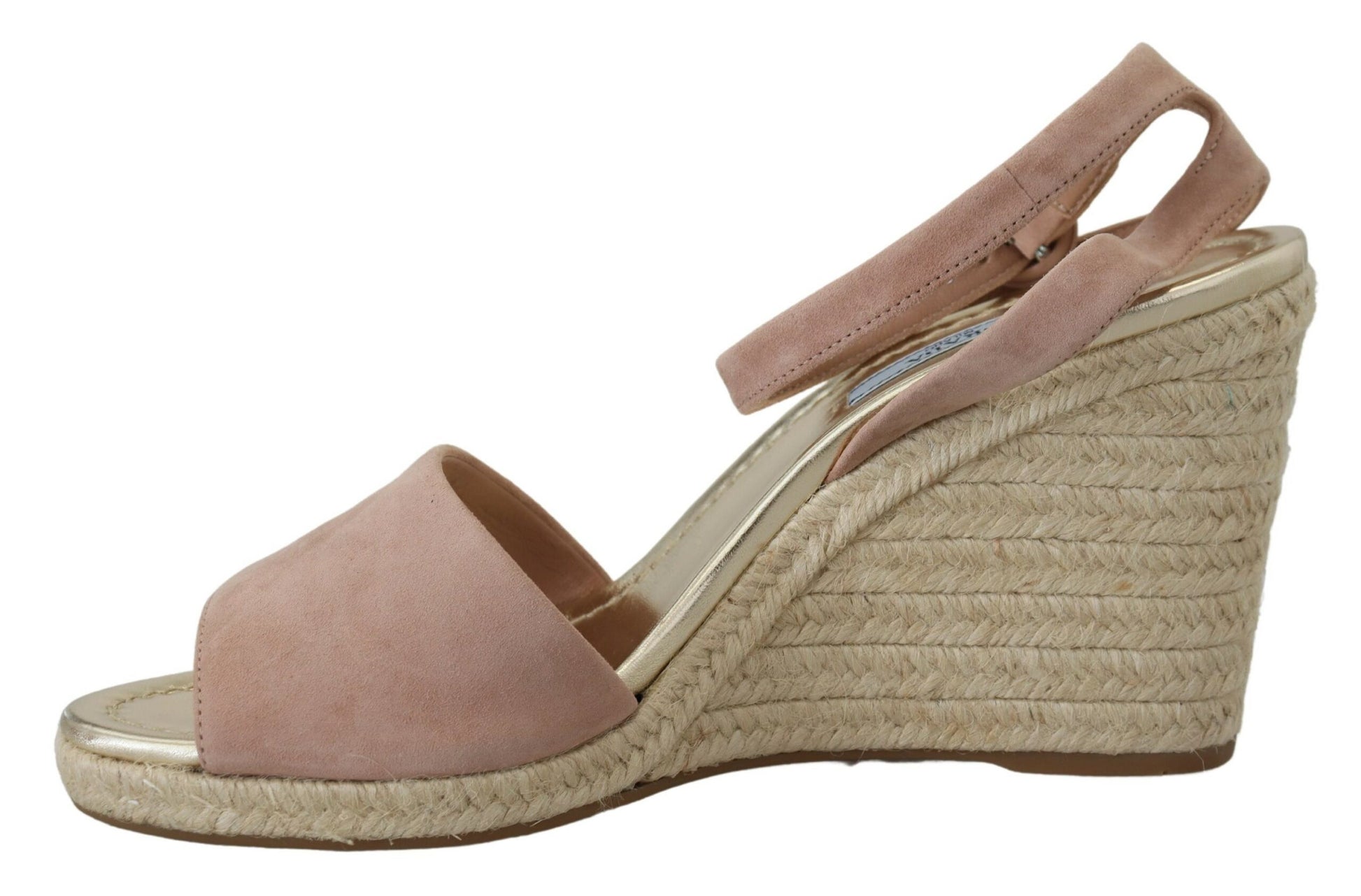 Pair of wedge sandals with a straw-like texture and pink straps