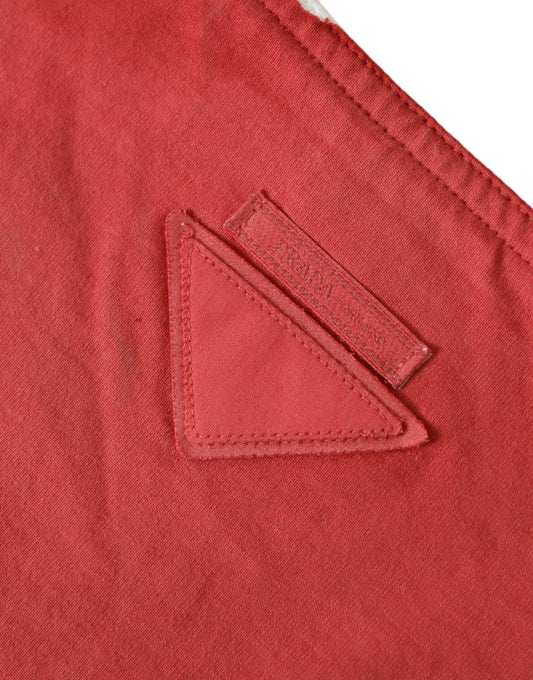 Red fabric with a triangular patch on the left side