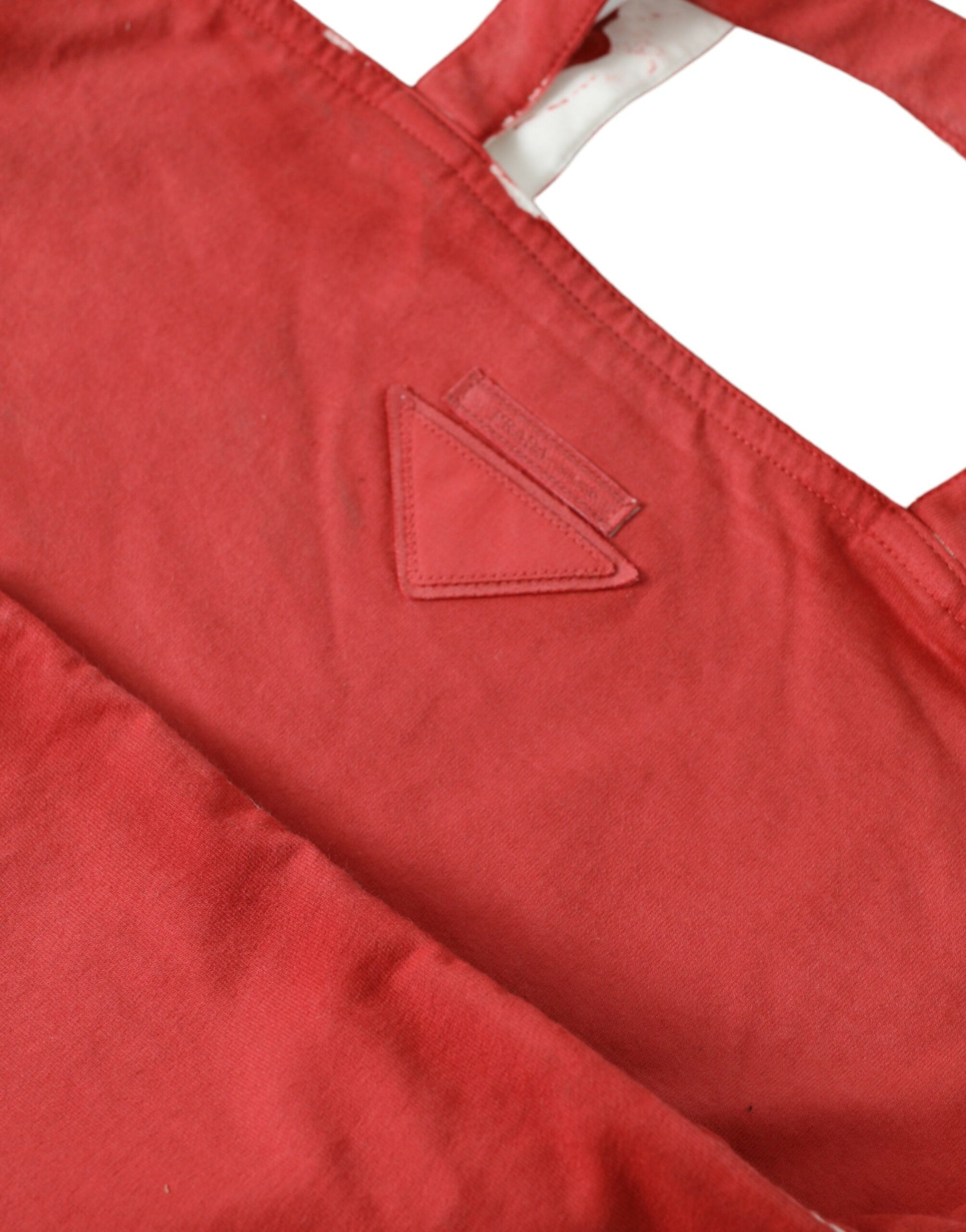 Red apron with a triangle logo on the left side