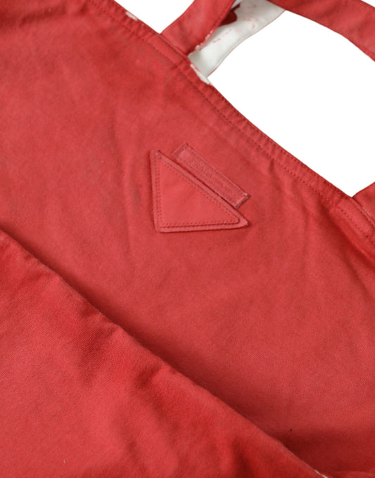 Red apron with a triangle logo on the left side