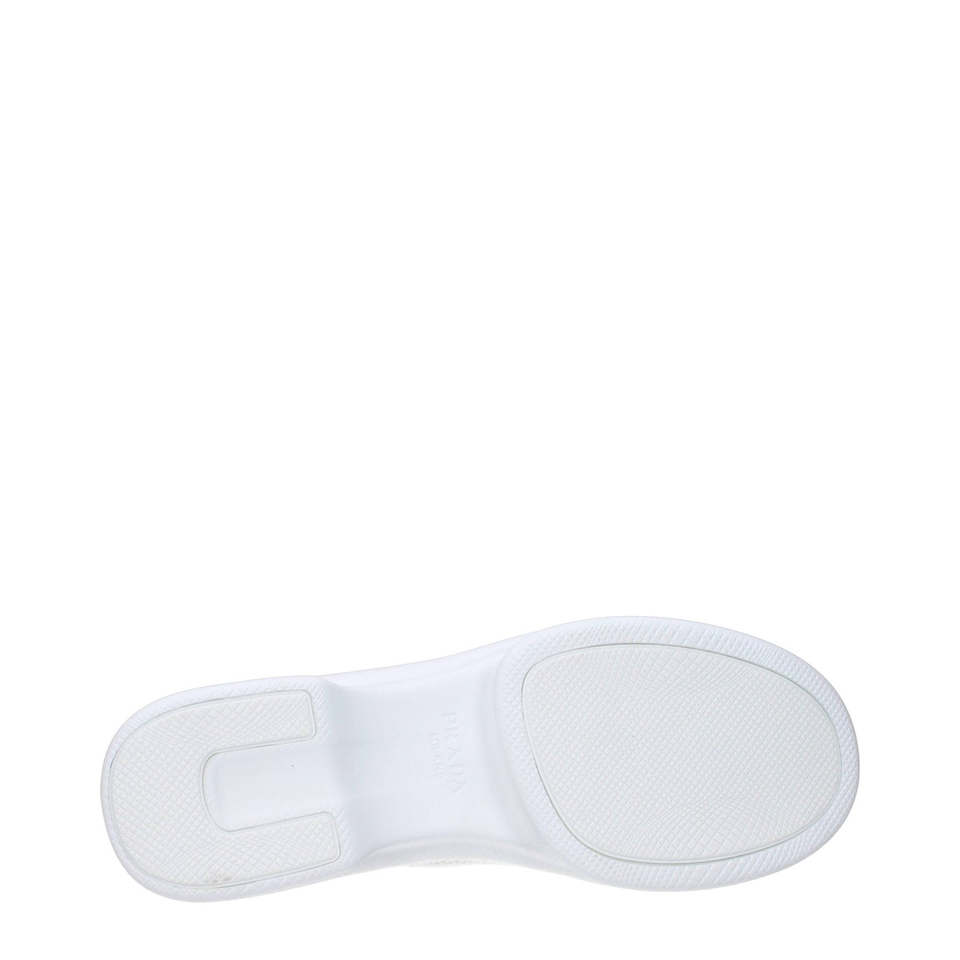 A single white athletic shoe with a textured sole, featuring a brand logo on the side