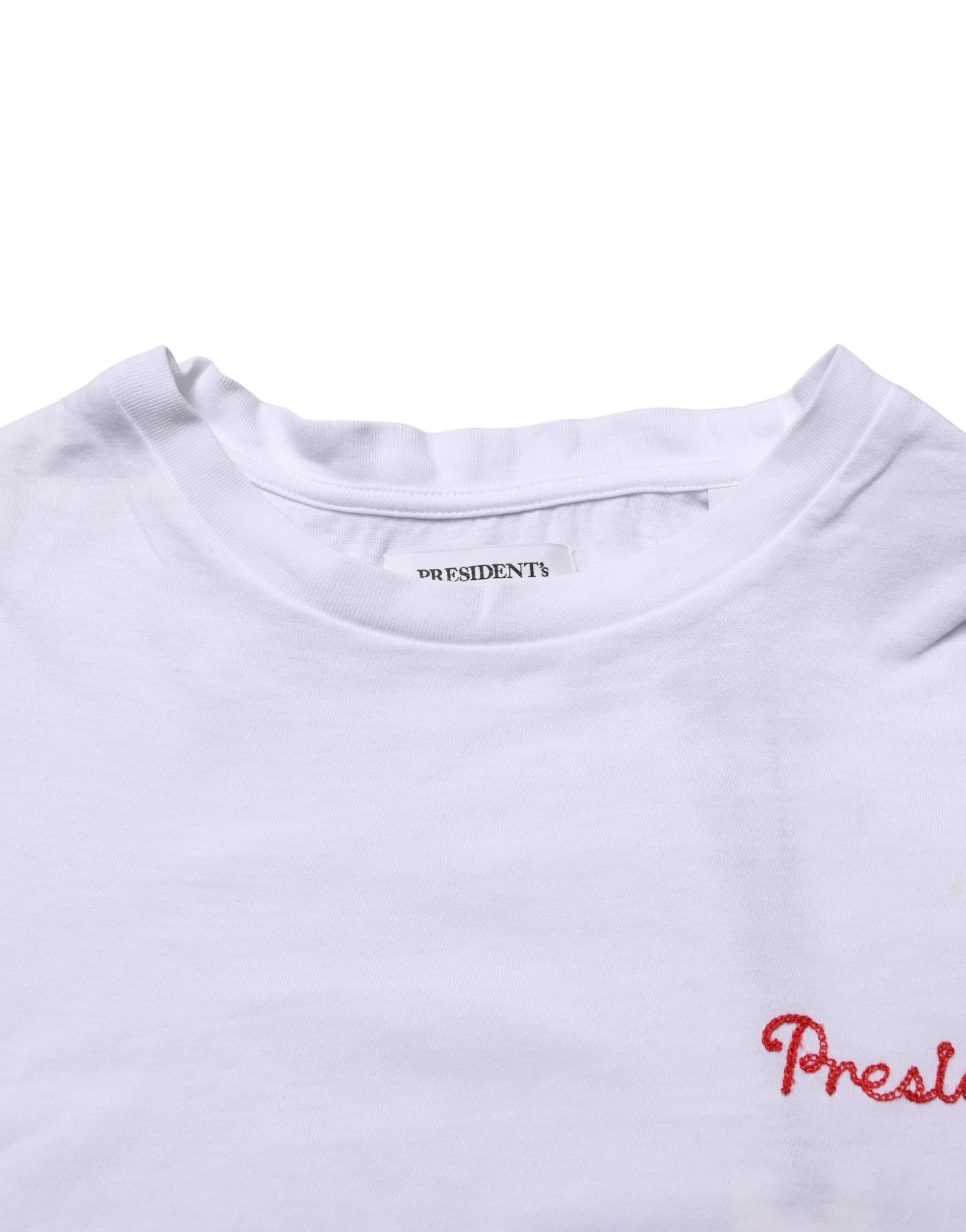 White t-shirt with red lettering on front